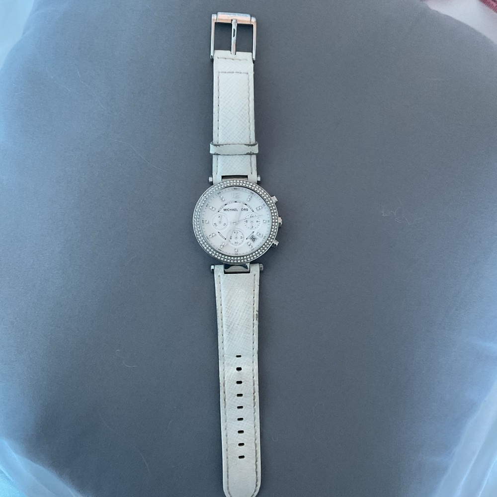 Michael Kors Women’s white leather watch w mother of pearl face & Rhinestones$25